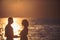 Couple in love relax on sunrise beach. couple in love on romantic date in sunset on beach at summer vacation, copy space