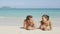Couple in love relaxing on beach - vacation travel