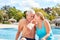 Couple in love seniors enjoying the spa holiday by the pool