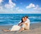 Couple in love sitting in blue beach