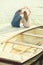 Couple in love sitting on the pier, their hands show heart