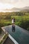 Couple in love standing on edge infinity pool with awesome view of rice terraces