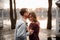 Couple in love standing head to head on the background of lake