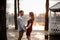 Couple in love standing opposite each other on the background of lake