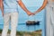 A couple in love stands on the beach in the dunes against the background of the Baltic sea and a ship, a Couple on the beach close