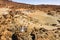 A couple in love stands in the crater of the Teide volcano. Desert landscape in Tenerife. Teide National Park. Tenerife