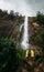 A couple in love stands by the waterfall