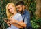 Couple in love, teacher and student reading, nature background, defocused.