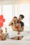 Couple, Love and Valentine`s Day Concept. Portrait of two smiling asian man surprised and close woman eye with gift box and