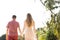 Couple in love walk hands on the beach on the tropical island of Koh Samui in Thailand