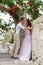 Couple in love walks and hugs on beautiful streets ancient city on summer day. Wedding couple waiting wedding ceremony