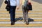 Couple in love walks on pedestrian crossing holding hands