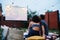 Couple in love watching a movie, in twilight, outside on the lawn in a courtyard