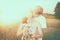 The couple in love in the wheat field in summer