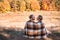 Couple in love wrapped in plaid outdoors.