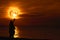 Couple lover selfie with full Sturgeon on sea and reflection moonlight on water surface