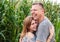 Couple of lovers laughing in corn field