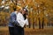 A couple of lovers run through the autumn park and have wonderful moments of happiness and joy.
