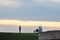 Couple, lovers, tourists taking pictures and posing in the Kalemegdan fortress park with a panorama of the skyscraper