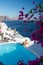 Couple at luxury infinity pool, antorini Greece, young couple on luxury vacation at the Island of Santorini watching