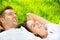 Couple Lying on Grass