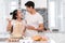 Couple making bakery, cake in kitchen room, Young asian man and woman together