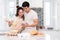 Couple making bakery in kitchen room, Young asian man and woman together