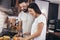 Couple making breakfast at home. Loving couple having fun in kitchen