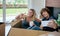 Couple making selfie sitting inside moving box