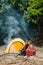 Couple making smores when camping in forest