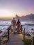 couple man and woman drinking coffee during on balcony sunrise at vacation in Cape Town South Africa