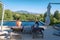 couple man and woman in swimming pool looking out over the Vineyards and mountains of Stellenbosch South Africa