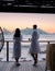 couple man and women drinking coffee on the balcony during sunrise in Cape Town South Africa.