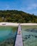 couple man and women on wooden board walk of a tropical Island in Thailand, Koh Kham near Koh Mak