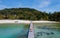 couple man and women on wooden board walk of a tropical Island in Thailand, Koh Kham near Koh Mak