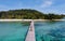 couple man and women on wooden board walk of a tropical Island in Thailand, Koh Kham near Koh Mak