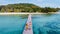 couple man and women on wooden board walk of a tropical Island in Thailand, Koh Kham near Koh Mak