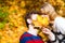 Couple with maple leaf kissing in autumn park