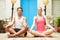 Couple Meditating Outdoors At Health Spa