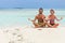 Couple Meditating at Tropical Paradise beach. San Blas Caribbean