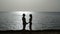 Couple meets sunrise near the sea