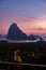 couple men and woman mid age watching sunrise in Phangnga bay Thailand, Phanga bay viewpoint, couple watching sunrise on