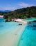 couple of men and woman walking at the beach of Koh Kham Trat Thailand