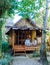 A couple of men and women at a bamboo hut homestay in Northern Thailand .