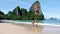 couple men and women on a tropical white beach in Thailand, Railay beach Krabi
