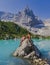 Couple of men and women visiting Lago di Sorapis in the Italian Dolomites