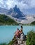 Couple of men and women visiting Lago di Sorapis in the Italian Dolomites,blue lake Lago di Sorapis, Lake Sorapis