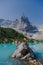 Couple of men and women visiting Lago di Sorapis in the Italian Dolomites,blue lake Lago di Sorapis, Lake Sorapis