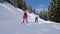 Couple Of Mom And Daughter Skiers Are Having Fun Skiing Down Mountain Slope