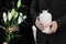 Couple with mortuary urn and flowers at funeral